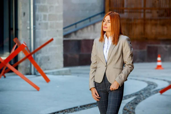 Confident business expert. Happy successful professional posing near office building. European girl. Russian business lady. Female business leader concept. Portrait Of Successful Business Woman