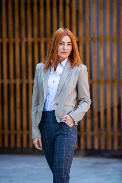 Confident business expert. Happy successful professional posing near office building. European girl. Russian business lady. Female business leader concept. Portrait Of Successful Business Woman