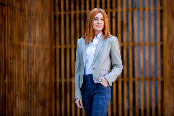 Confident business expert. Happy successful professional posing near office building. European girl. Russian business lady. Female business leader concept. Portrait Of Successful Business Woman