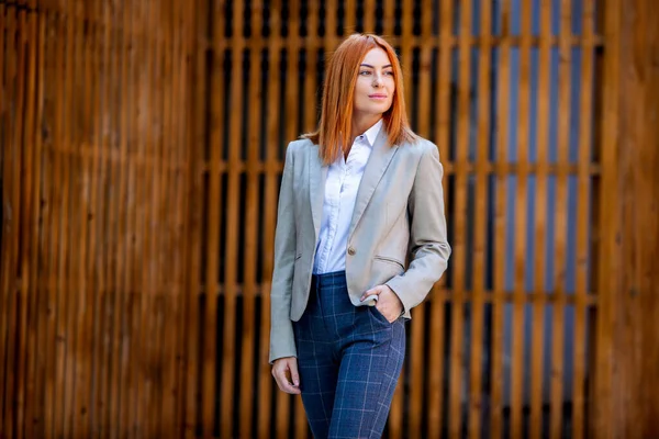 Confident business expert. Happy successful professional posing near office building. European girl. Russian business lady. Female business leader concept. Portrait Of Successful Business Woman