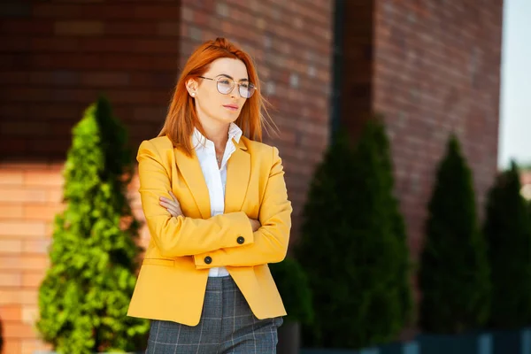 Confident business expert. Happy successful professional posing near office building. European girl. Russian business lady. Female business leader concept. Portrait Of Successful Business Woman