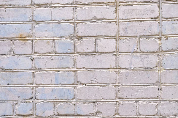 Beyaz tuğla duvar arka plan. Taştan bir duvar dokusu. Tuğla duvar beyaz renkte boyalı