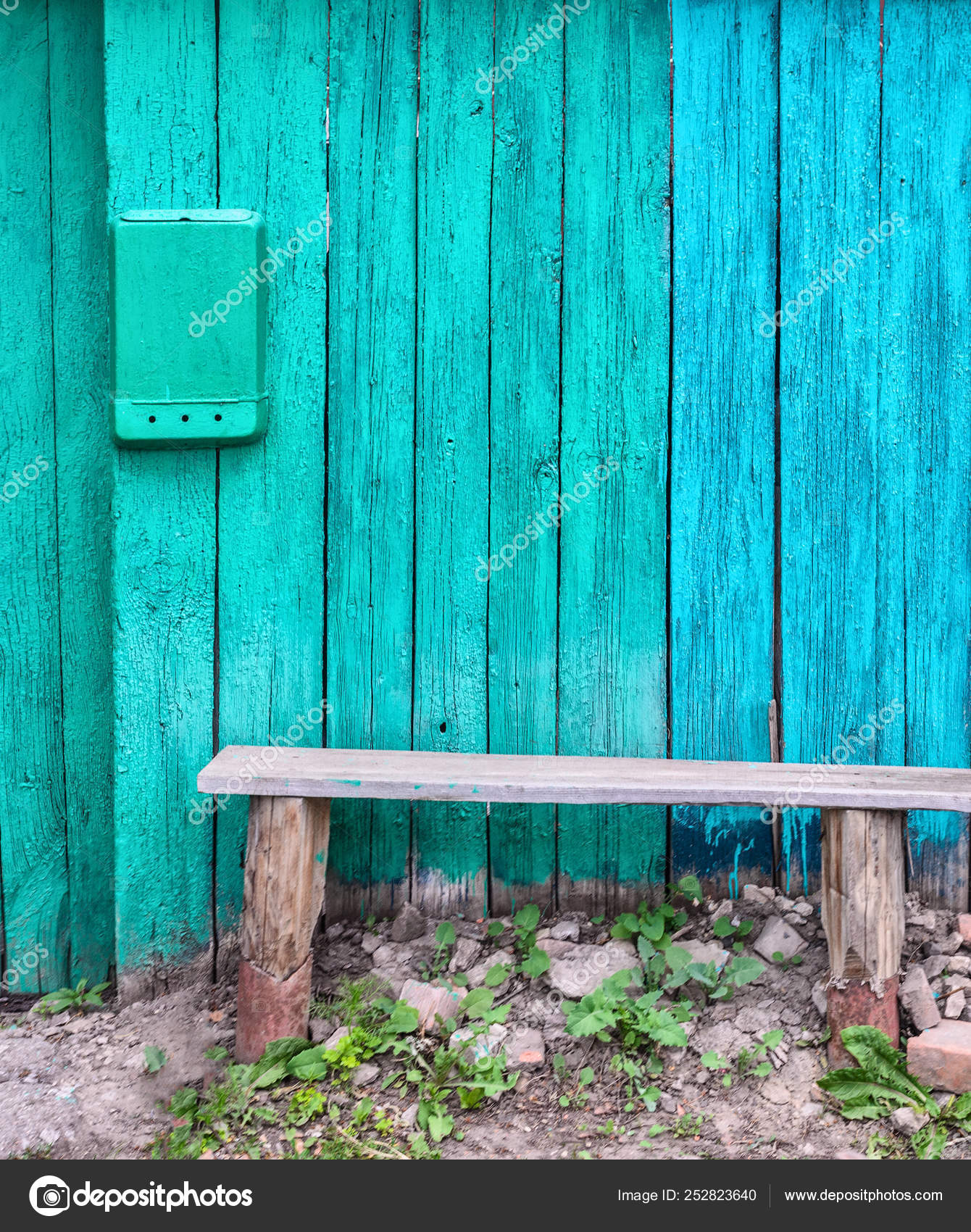 A Typical Old Wooden Bench Near The Fence In The Russian Outback