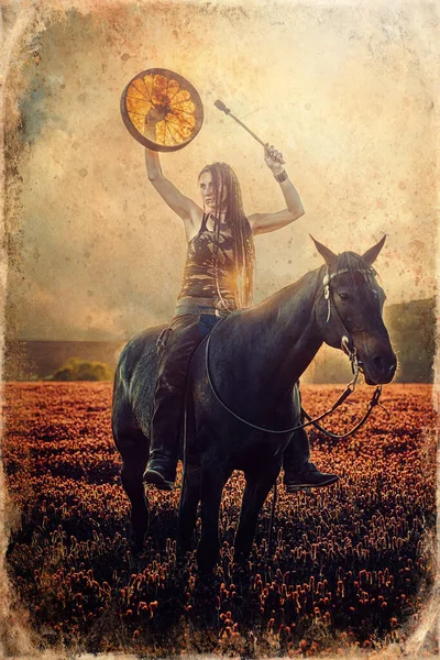 Young dreadded girl with her horse and shamanic frame drum. — Stock Photo, Image