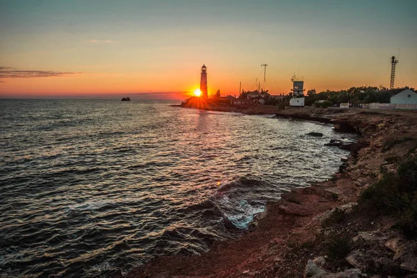 Image of lighthouse at sunset in Olenivka in Crimea in Russia