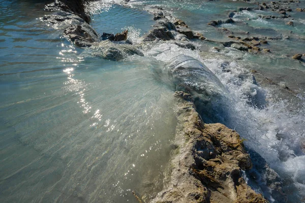 Saturnian natural spa with waterfalls and hot springs at  thermal baths in Tuscany in Italy