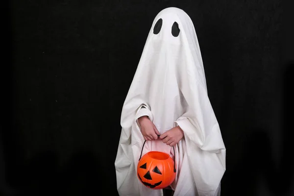 White Ghost with a knife in blood on black background. Halloween holiday party. — Stock Photo, Image