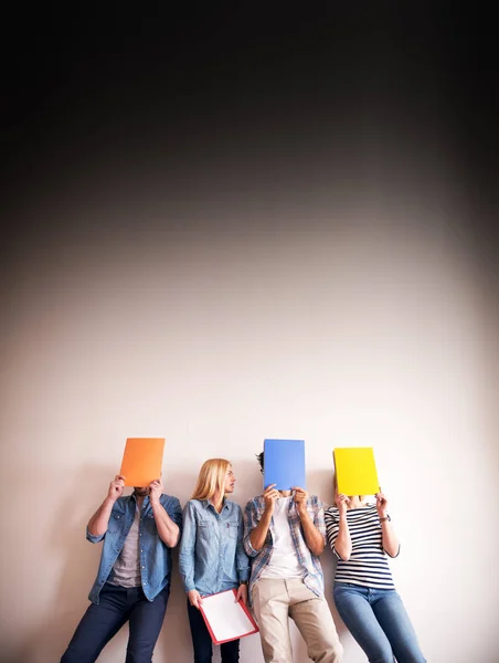 Group Young People Covering Faces Colorful Folders — Stock Photo, Image