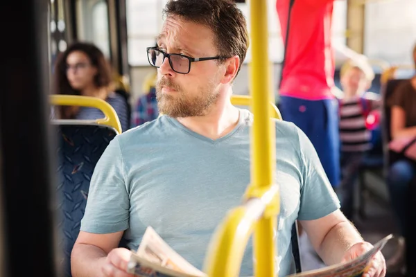 Young Man Holding Newspaper Bus — Stock Photo, Image