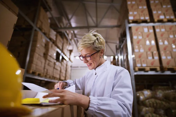 Young Female Worker Looking Documents Satisfaction Storage Room — Stock Photo, Image