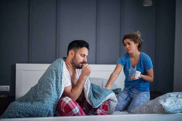 Careful Young Woman Bringing Medications Ill Boyfriend Bed — Stock Photo, Image