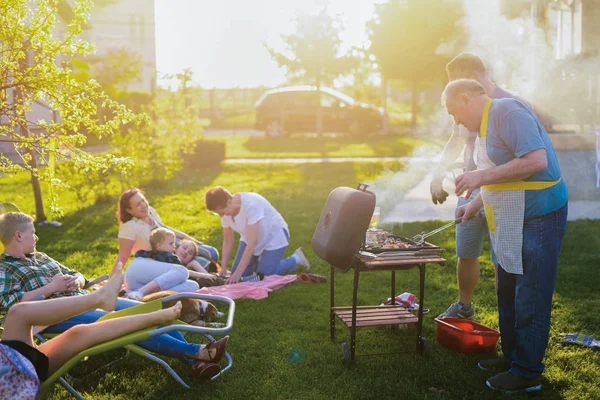 happy family having a picnic at backyard on a beautiful summer day