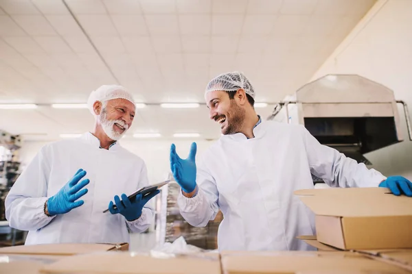 Two Male Colleagues Sterile Clothes Preparing Boxes Products Transport Standing — Stock Photo, Image