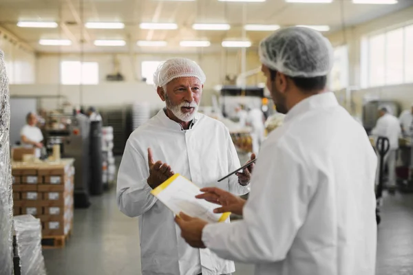 Two Serious Business Man Sterile Clothes Standing Food Factory Talking — Stock Photo, Image