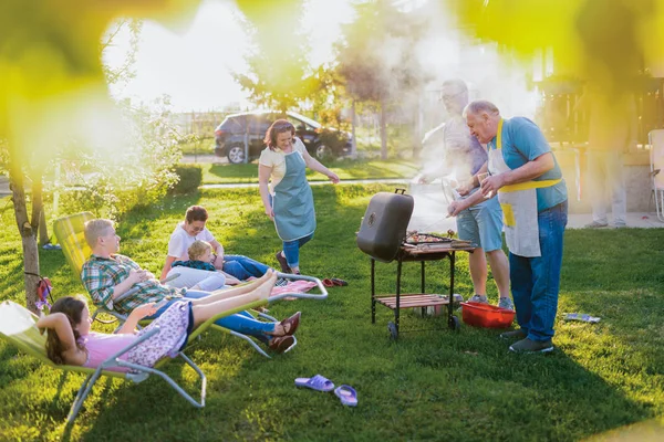 happy family having a picnic at backyard on a beautiful summer day