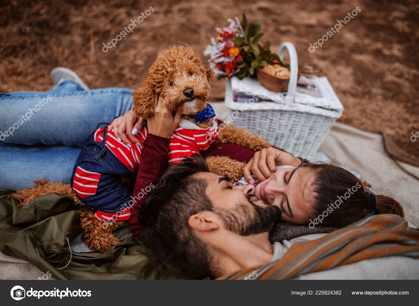 Couple Picnic Lying Blanket Dog Cuddling Next Them Picnic Basket