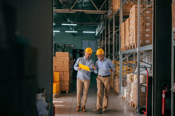 Colleagues Walking Storage Checking Documentation Heads Helmets — Stock Photo, Image