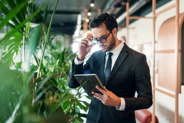 Businessman Serious Face Expression Using Tablet While Standing Lobby — Stock Photo, Image