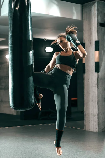 Caucasian Woman Sportswear Boxing Gloves Kicking Bag Gym Full Length — Stock Photo, Image