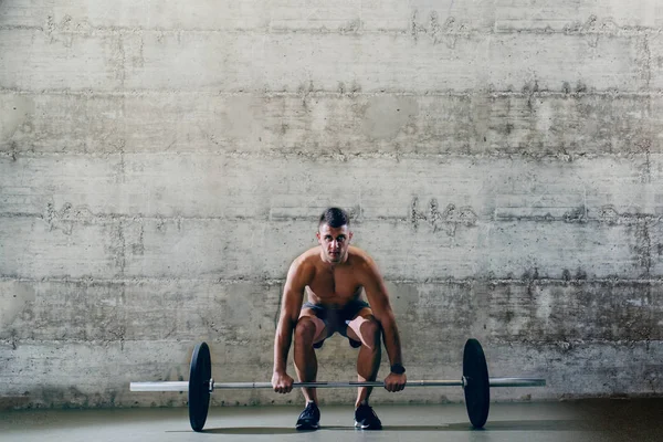 Serious Caucasian Shirtless Man Shorts Lifting Barbell Background Wall — Stock Photo, Image