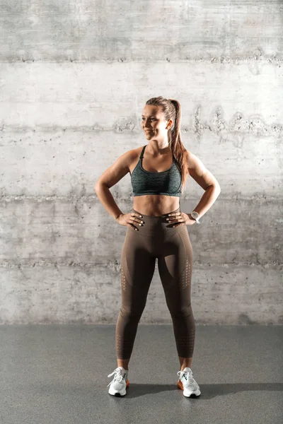 Full Length Fitness Ponytail Sportswear Standing Hands Hips Front Rustic — Stock Photo, Image