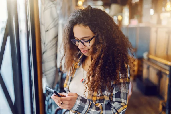 Cute Mixed Race Girl Curly Hair Standing Cafeteria Using Smart — Stock Photo, Image