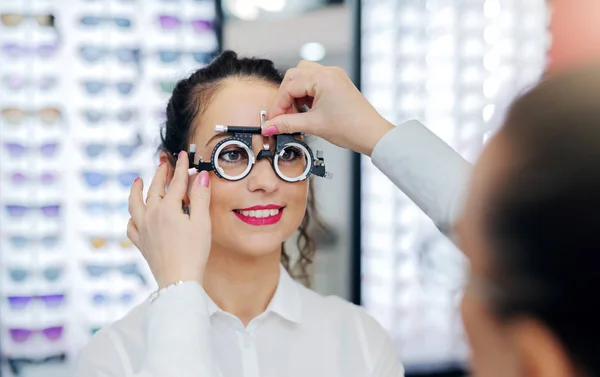 Ophthalmologist Putting Test Glasses Phoropter Checking Eyesight Patient Woman Smiling — Stock Photo, Image