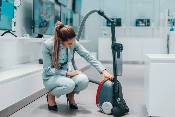 Happy Caucasian Brunette Formal Wear Crouching Trying Out New Vacuum — Stock Photo, Image