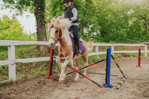 Young Playful Caucasian Girl Helmet Protective Vest Riding Adorable Pony — Stock Photo, Image