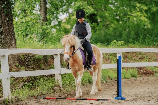 Young Playful Caucasian Girl Helmet Protective Vest Riding Adorable Pony — Stock Photo, Image