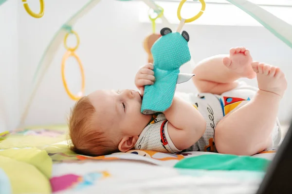 Adorable Six Months Old Boy Lying Bed Biting Playing Crib — ストック写真