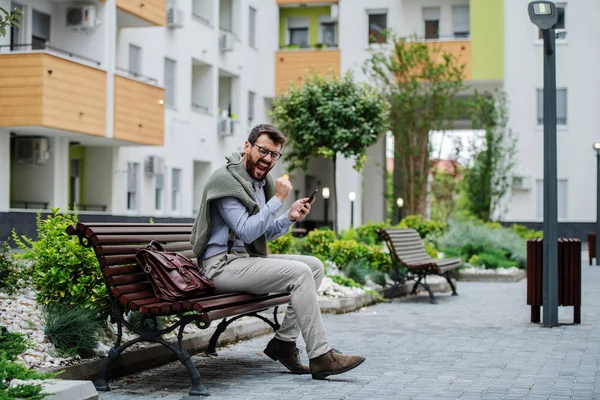 Successful Handsome Fashionable Caucasian Businessman Sitting Bench Park Holding Smart — Stock Photo, Image