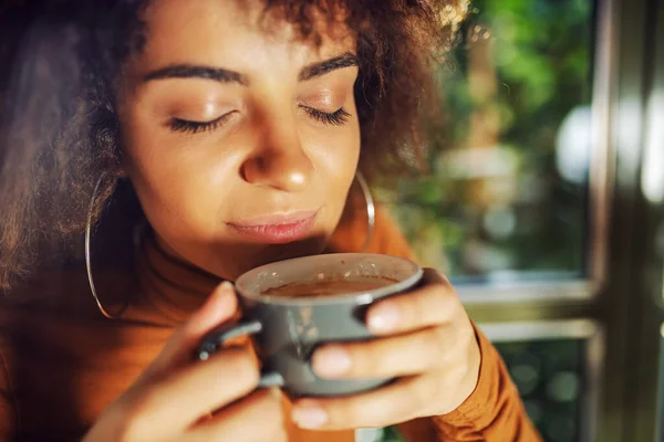 Closeup Mixed Race Woman Holding Cup Coffee Smelling — Stock Photo, Image