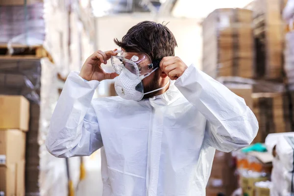 Dedicated Worker White Sterile Uniform Standing Warehouse Putting Protective Glasses — Stock Photo, Image