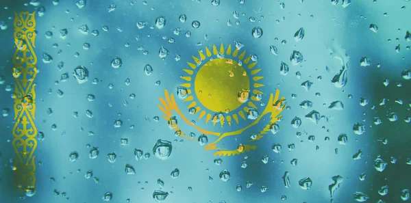 Flag of Kazakhstan  on a water drops background. Flags waterdrop texture.