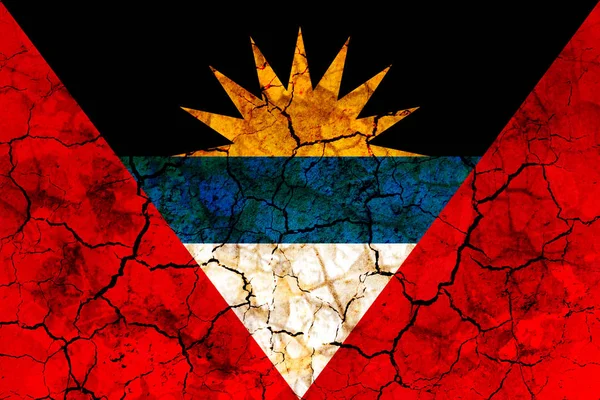 antigua and barbuda country flag symbol painted on a cracked grungy wall. Concept of drought, hardship, no rain or economic crysis
