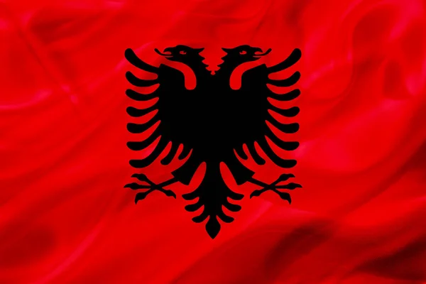 Vlajka země Albánie na hedvábí nebo hedvábná mávající textura — Stock fotografie