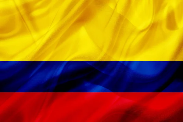 Colombia country flag on silk or silky waving texture — Stock Photo, Image