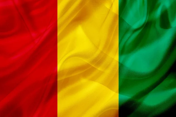 Guinea country flag on silk or silky waving texture