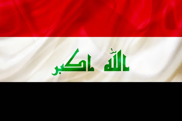 Irak land flagga på siden eller silkeslen viftande textur — Stockfoto