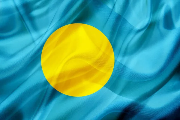 Bandera del país de Palau sobre seda o textura sedosa ondulante — Foto de Stock