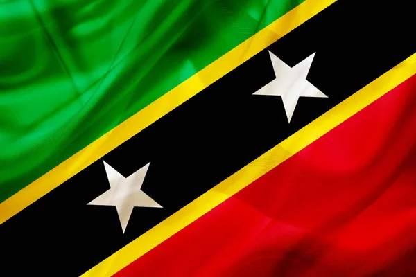 Saint Kitts and Nevis country flag on silk or silky waving textu — Stock Photo, Image