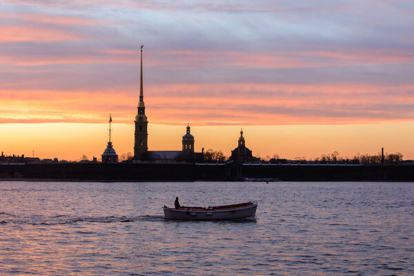 Neva river Saints Peter and Paul Cathedral of fortress at sunset in Saint Petersburg, Russia