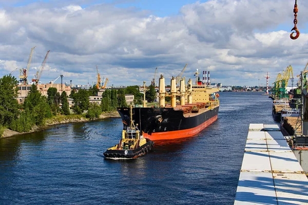 Towing of cargo vessel in port