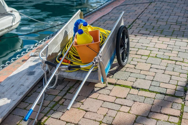 Professional cleaning cart with equipment for washing the yacht.