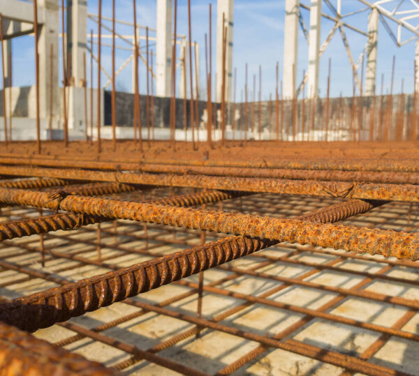 Cell reinforcing metal mesh. Preparation for pouring the concrete. Selective focus.