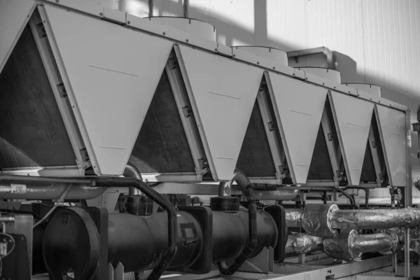 Industrial ventilation system of industrial facility. Black-and-white photo.