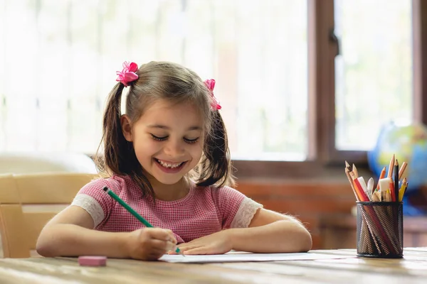 Happy Little Child Girl Drawing Picture in School