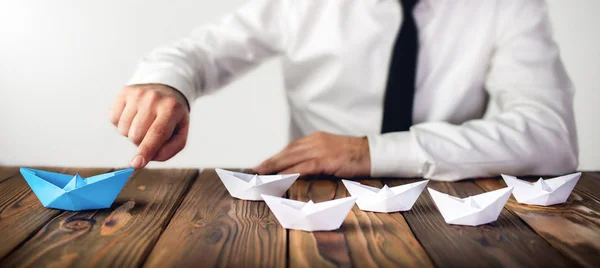 Leadership Concept with Businessman and Paper Ship