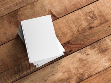 Tahta masanın üzerinde üç tane boş kitap var. 3d oluşturma